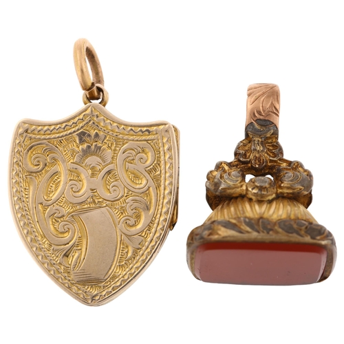 1269 - A Victorian banded agate shield photo locket pendant, and a gilt-metal carnelian fob, pendant height... 