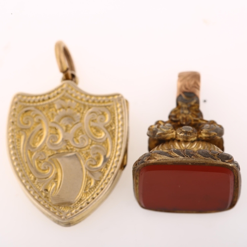 1269 - A Victorian banded agate shield photo locket pendant, and a gilt-metal carnelian fob, pendant height... 