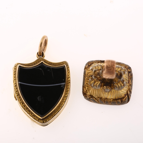 1269 - A Victorian banded agate shield photo locket pendant, and a gilt-metal carnelian fob, pendant height... 