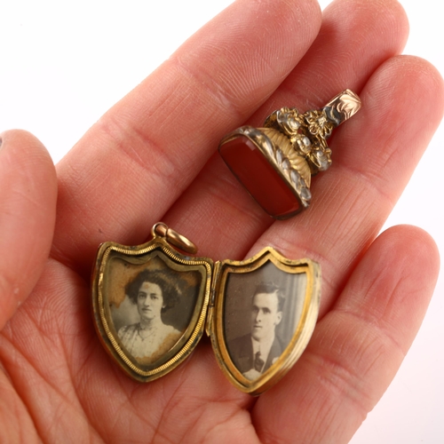 1269 - A Victorian banded agate shield photo locket pendant, and a gilt-metal carnelian fob, pendant height... 