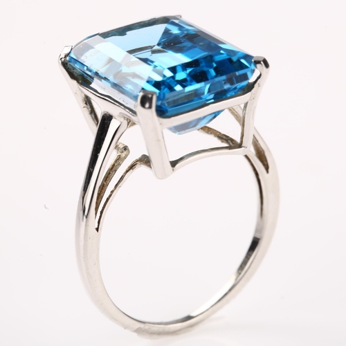 1274 - A modern 9ct white gold blue topaz dress ring, topaz length 16.3mm, size N, 5.3g