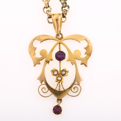 1285 - An Edwardian Art Nouveau 9ct gold amethyst and pearl openwork pendant necklace, on gold plated facet... 