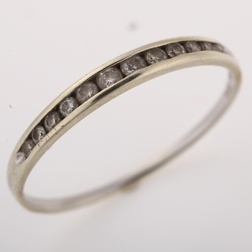 1292 - A modern 9ct white gold diamond half eternity ring, channel set with modern round brilliant-cut diam... 