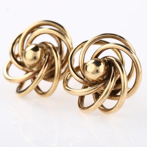 1300 - A pair of 9ct gold spiral openwork earrings with stud fittings, maker's marks C and F, earring diame... 