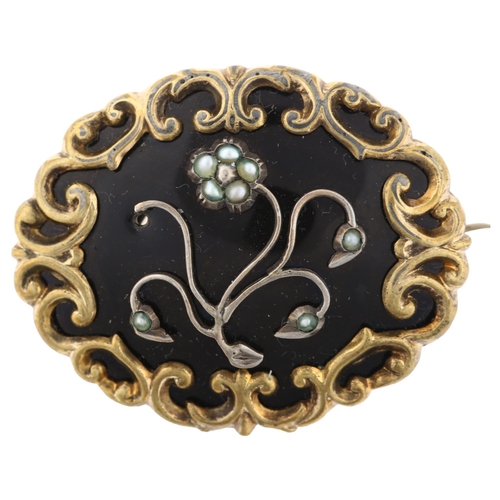 1301 - A Victorian split pearl and black enamel floral mourning brooch, unmarked gilt-metal settings with o... 