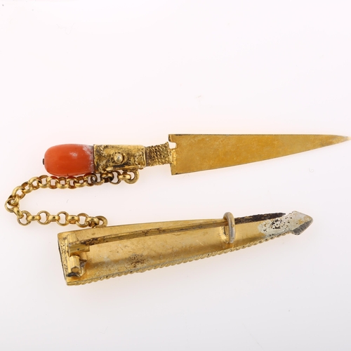 1302 - A novelty miniature coral dagger brooch, unmarked yellow metal setting with rope wire decoration, in... 