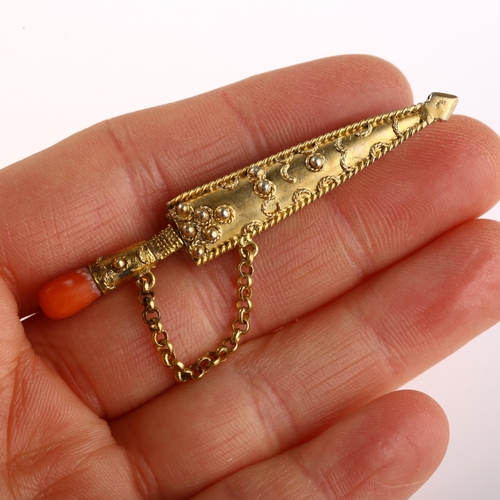 1302 - A novelty miniature coral dagger brooch, unmarked yellow metal setting with rope wire decoration, in... 