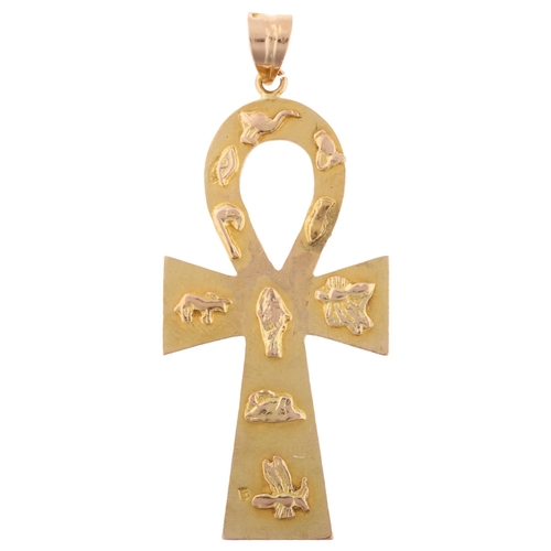 1307 - A large Egyptian Ankh cross pendant, unmarked gold settings with relief hieroglyphs, pendant height ... 