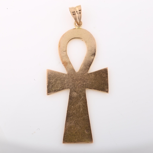 1307 - A large Egyptian Ankh cross pendant, unmarked gold settings with relief hieroglyphs, pendant height ... 