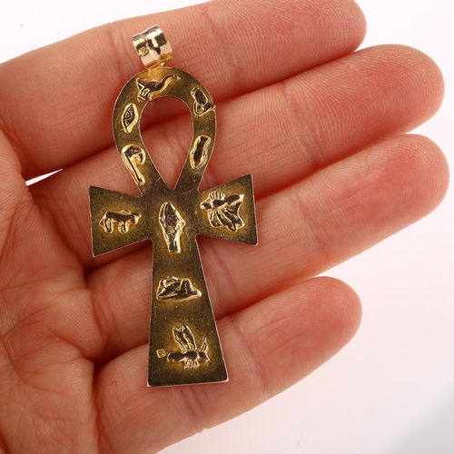 1307 - A large Egyptian Ankh cross pendant, unmarked gold settings with relief hieroglyphs, pendant height ... 