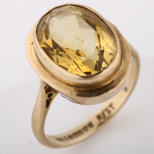 1310 - A mid-20th century 9ct gold citrine dress ring, set with oval mixed-cut citrine, hallmarks Birmingha... 