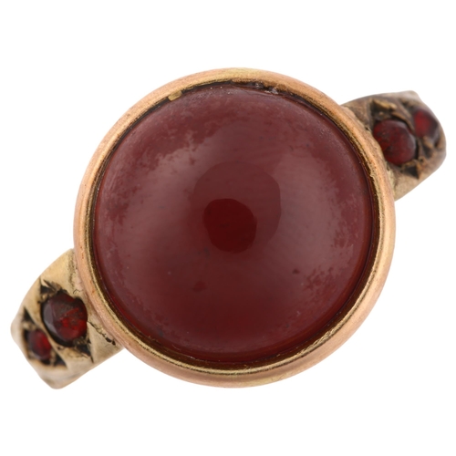 1312 - An Antique garnet dress ring, unmarked gold closed-back settings with round cabochon garnet, setting... 