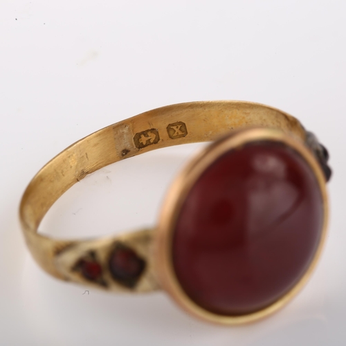 1312 - An Antique garnet dress ring, unmarked gold closed-back settings with round cabochon garnet, setting... 