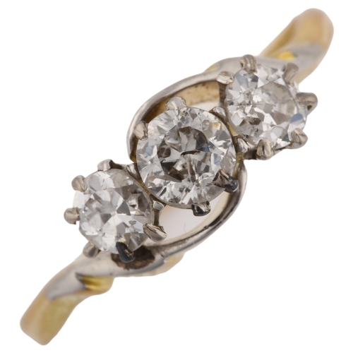 1314 - An early 20th century 18ct gold three stone diamond crossover ring, set with old European-cut diamon... 