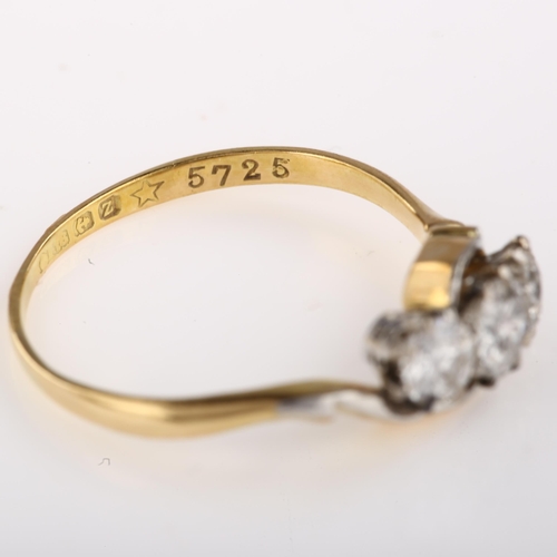 1314 - An early 20th century 18ct gold three stone diamond crossover ring, set with old European-cut diamon... 