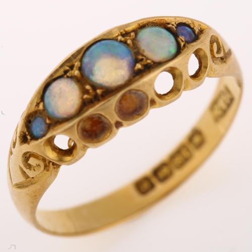 1317 - An early 20th century 18ct gold graduated five stone opal half hoop ring, set with round cabochon op... 