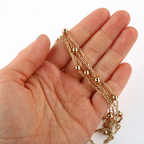 1319 - An Antique 9ct rose gold long guard chain necklace, with ball spacers, length 144cm, 17.3g