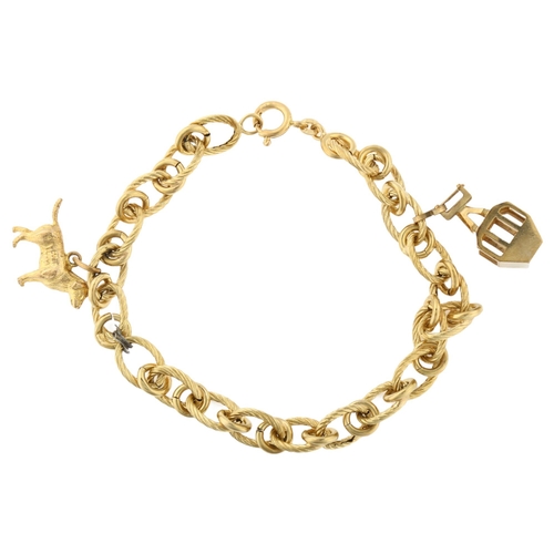 1332 - An Italian 18ct gold hollow link charm bracelet, with 2 x 9ct gold charms, bracelet length 20cm, 12.... 