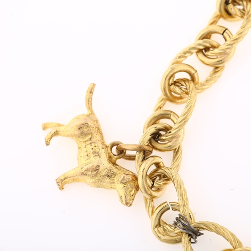 1332 - An Italian 18ct gold hollow link charm bracelet, with 2 x 9ct gold charms, bracelet length 20cm, 12.... 