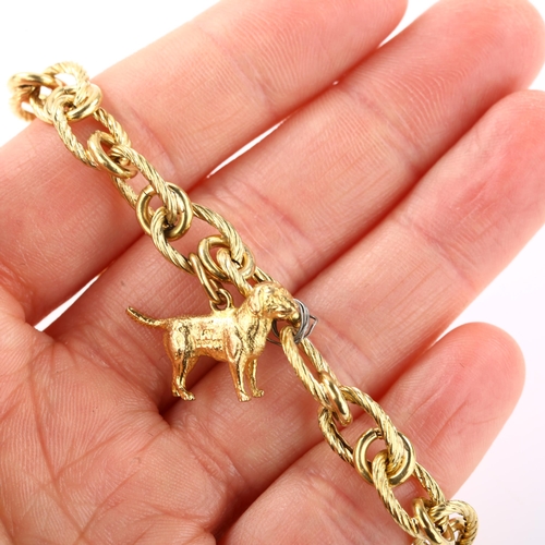 1332 - An Italian 18ct gold hollow link charm bracelet, with 2 x 9ct gold charms, bracelet length 20cm, 12.... 