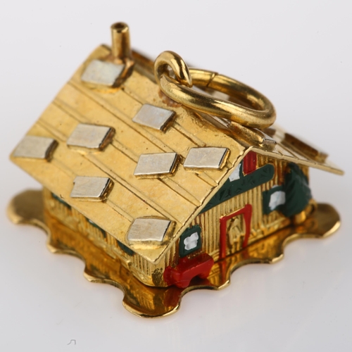 1333 - A Continental 18ct gold and enamel kinetic chalet charm, opening to reveal couple in bed, charm leng... 