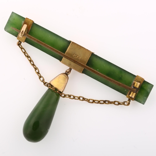 1347 - A Victorian 9ct gold mounted nephrite bar brooch, with nephrite drop, brooch length 50.8mm, 6.7g