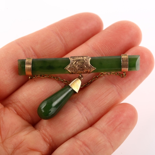 1347 - A Victorian 9ct gold mounted nephrite bar brooch, with nephrite drop, brooch length 50.8mm, 6.7g