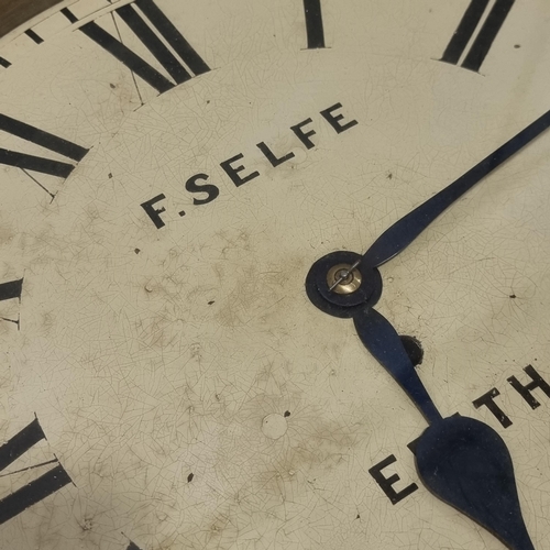 291 - A late 19th century 30 hour mahogany circular dial shop clock, by F Selfe of Erith, with pendulum an... 