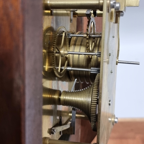 292 - A reproduction mahogany cased 30-hour circular dial shop clock, with pendulum and key, diameter 38cm