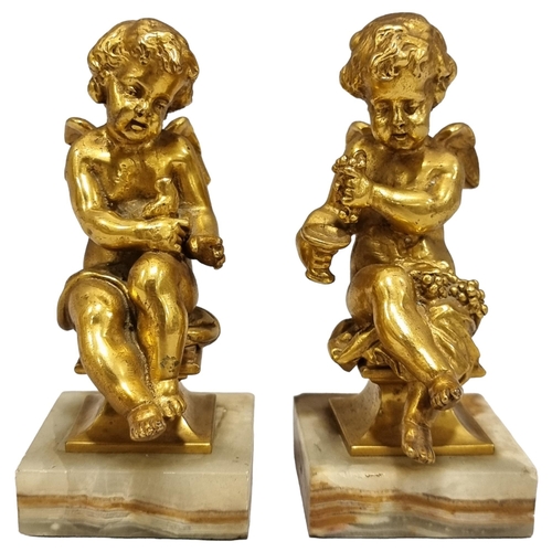 49 - A pair of cast-brass cherub figures on green onyx bases, height 14cm