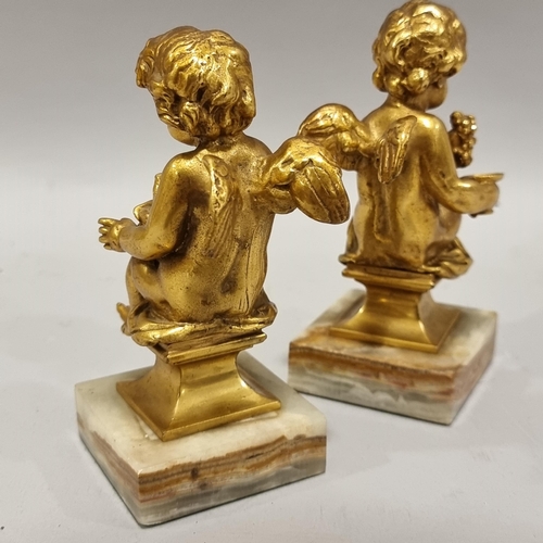 49 - A pair of cast-brass cherub figures on green onyx bases, height 14cm