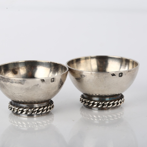 1525 - A pair of Art Deco French silver salt cellars, by Jean Depres, Paris, circa 1930, diameter 4cm