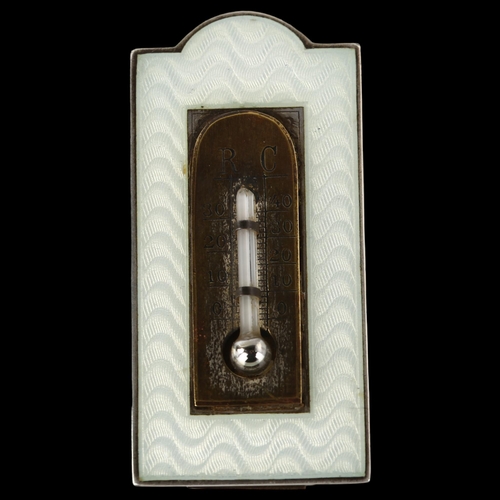 1526 - An Art Deco miniature novelty enamel thermometer, unmarked silver frame with engine turned guilloche... 