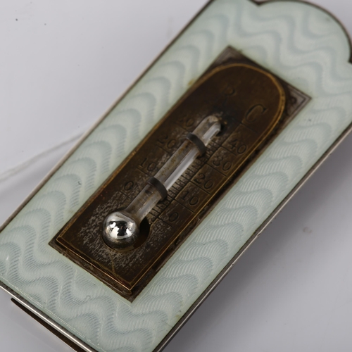 1526 - An Art Deco miniature novelty enamel thermometer, unmarked silver frame with engine turned guilloche... 