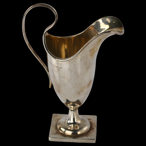 1537 - A George V silver pedestal helmet cream jug, by Henry Williamson Ltd, hallmarks Birmingham 1910, hei... 