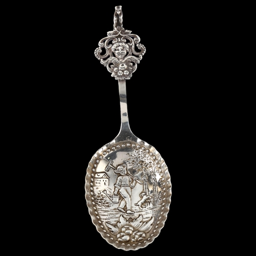 1548 - A large Dutch silver serving spoon, with relief embossed farmer bowl and bear handle, circa 1900, le... 