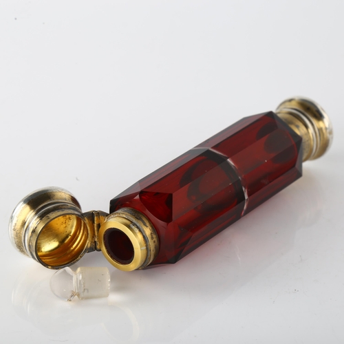 1551 - A 19th century silver-gilt mounted ruby glass double-ended scent flask, unmarked, length 13.5cm