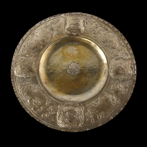 1555 - An Arts and Crafts Victorian silver salver, relief embossed with escutcheons of England Scotland and... 