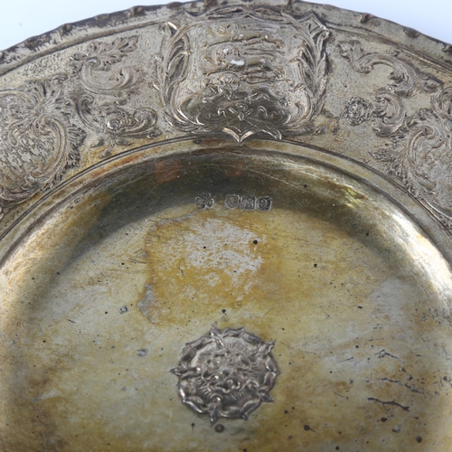 1555 - An Arts and Crafts Victorian silver salver, relief embossed with escutcheons of England Scotland and... 