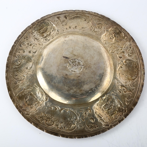 1555 - An Arts and Crafts Victorian silver salver, relief embossed with escutcheons of England Scotland and... 