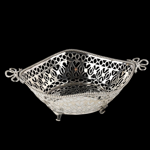 1560 - A Dutch silver 2-handled bon bon dish, pierced lattice decoration with bead edge and ribbon bow hand... 