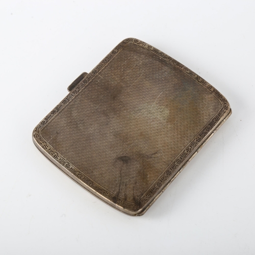 1566 - A George V silver cigarette case, curved rectangular form with allover engine turned decoration and ... 