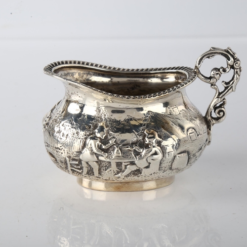 1574 - A Victorian silver cream jug, oval bulbous form with relief embossed village decoration and gadroone... 