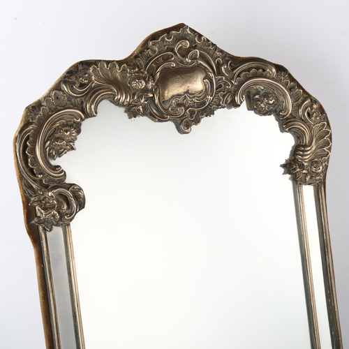 1579 - A large Edwardian silver-fronted dressing table mirror, with relief embossed foliate decoration and ... 