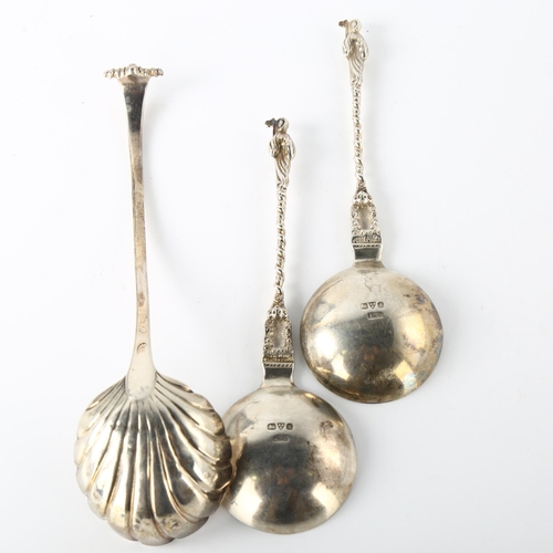 1583 - An Antique Irish silver shell sauce ladle, and a pair of silver Apostle spoons, ladle length 20cm, 5... 