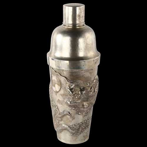 1600 - A large Chinese silver 'dragon' cocktail shaker, with high relief embossed dragon decoration, by Sta... 