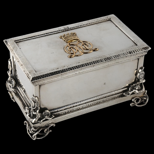 1604 - A fine quality Victorian cast-silver and gold desk casket, rectangular form, with hand planished dec... 