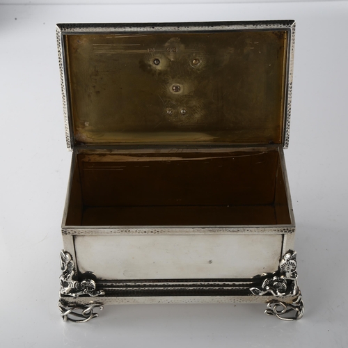 1604 - A fine quality Victorian cast-silver and gold desk casket, rectangular form, with hand planished dec... 