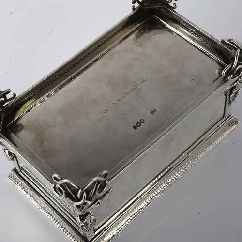 1604 - A fine quality Victorian cast-silver and gold desk casket, rectangular form, with hand planished dec... 