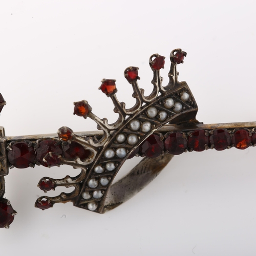 1387 - A large Continental silver garnet and pearl crown and sword brooch, brooch length 76.6mm, 9.8g, in f... 